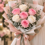 Pink and white rose bouquet with eucalyptus and tiny white flowers, finished with pink and grey satin ribbons