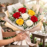All the Reasons - Mixed 7 Rose Bouquet w model